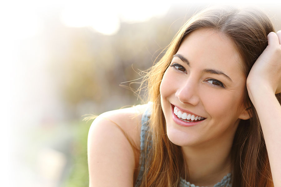 Young woman with lovely white teeth smile